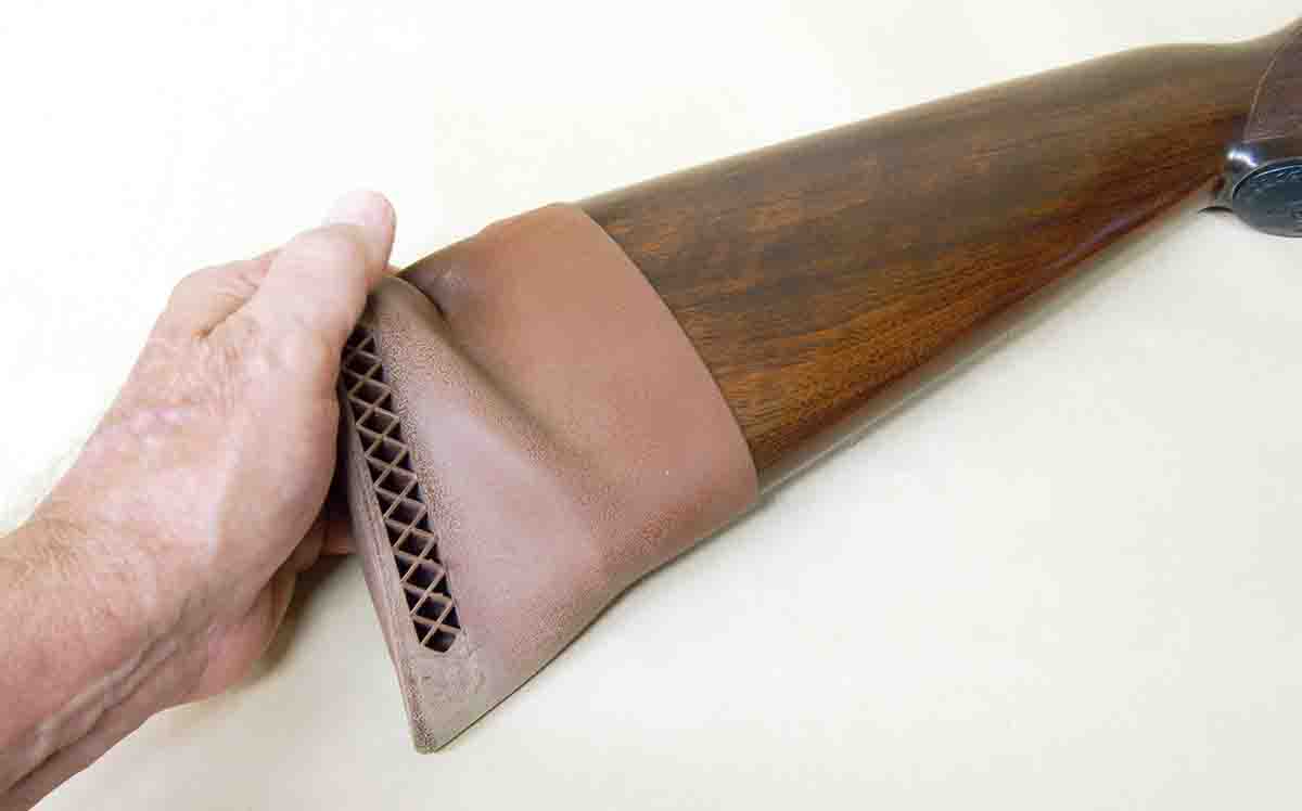 A pull-on pad is stretched over a stock to add to length of pull.